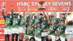  ?? PAUL MILLER, EPA ?? BLITZING SYDNEY: The South African Sevens team celebrate their victory over England in the Cup Final in Sydney yesterday.