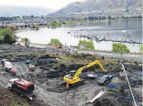  ?? PHOTO: TIM MILLER ?? At work . . . Debris from a landslip which closed a section of Lakeside Rd in Wanaka for more than a week was finally cleared yesterday afternoon, allowing the Queenstown Lakes District Council to open the section to one lane. There is no timeline for...