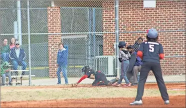  ?? / kevin Myrick ?? Austin Dowdy of one of the local Braves teams took to the field along with his fellow players for the 2019 opening day game against the Cubs. field this weekend for Opening Day 2019 in Cedartown.right:Teams got busy on the baseball