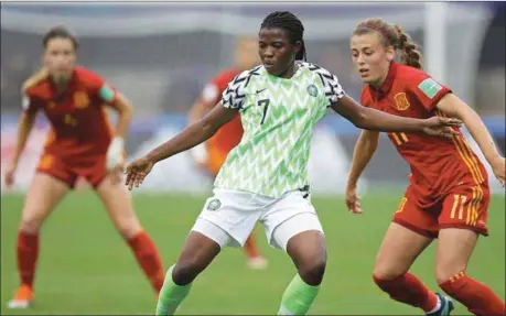  ??  ?? Falconets’ Peace Efih (centre) shields the ball from Carmen Menayo of Spain during the quarterfin­al clash between Nigeria and the European U-19 champions at the ongoing FIFA Under-20 Women’s World Cup in France… yesterday
