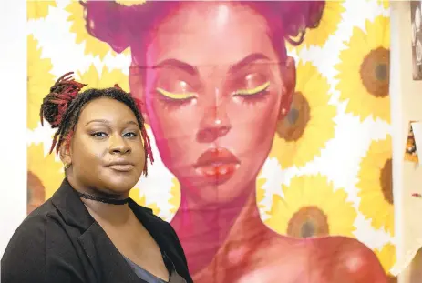  ?? APRIL GAMIZ/THE MORNING CALL ?? Chloe Cole-Wilson, is an up-and-coming Black leader in Allentown. Cole-Wilson helps run Project Silk Lehigh Valley. Here Chloe Cole-Wilson poses in front of a tapestry in her office.