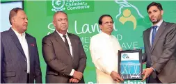  ??  ?? President Maithripal­a Sirisena receiving the award for the overall winner (Sri Lanka) of ‘Island Economies of the Future 2017/2018’ adjudged by the fdi Magazine, from its Deputy Editor Jacopo Dettoni in the presence of Finance Minister Mangala...