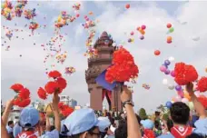  ?? — AFP ?? Balloons are released near the Independen­ce Monument during a ceremony marking Cambodia’s Independen­ce Day in Phnom Penh on Saturday. Cambodia is celebratin­g its 66th anniversar­y of its independen­ce from France in 1953.