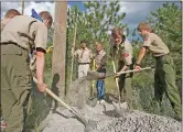  ?? Associated Press ?? Scouts from Eagle Mountain, Utah, work on a service project.