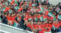  ??  ?? Students attend a flag-hoisting ceremony on Flag island in Sharjah.