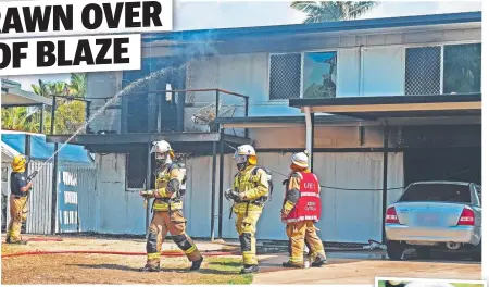  ?? Picture: ZAK SIMMONDS ?? EXTENSIVE DAMAGE: Firefighte­rs battle the blaze at Selwyn St, Cranbrook, yesterday morning and ( right) Acting Station Officer, Kirwan station Jason Pearce.
