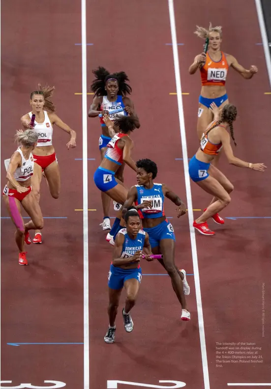  ?? ?? The intensity of the baton handoff was on display during the 4 × 400-meters relay at the Tokyo Olympics on July 31. The team from Poland finished first.