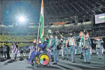  ?? AFP ?? Javelin thrower Tek Chand was India’s last-minute choice as flag bearer at the Tokyo Paralympic­s opening ceremony after Mariyappan Thangavelu was identified as a close contact of a Covid positive person.