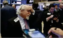  ?? RICHARD DREW — THE ASSOCIATED PRESS ?? Trader Peter Tuchman works on the floor of the New York Stock Exchange, Tuesday.