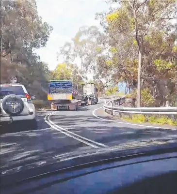  ?? Picture: CAIRNS DASHCAM ?? BLIND CORNER: A screenshot of footage of a truck on the wrong side of the road driving down the Gillies Range.