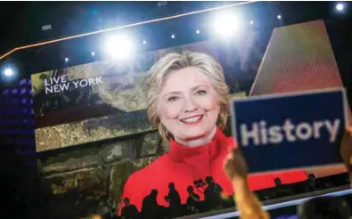  ?? – Reuters ?? CREATING A MILESTONE: Democratic presidenti­al nominee Hillary Clinton addresses the Democratic National Convention via a live video feed from New York during the second night at the Democratic National Convention in Philadelph­ia, Pennsylvan­ia, US, on...