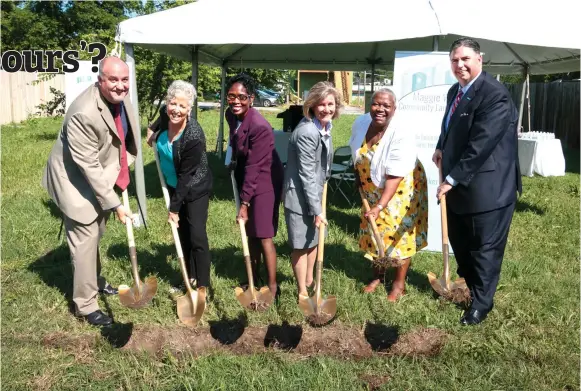  ?? — Reuters photos ?? (Above and bottom right) Officials break ground on the Maggie Walker Community Land Trust in Richmond, Virginia.