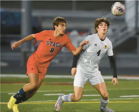  ?? STEVE JOHNSTON/DAILY SOUTHTOWN ?? Stagg’s Kacper Dziubek, left, works for the ball against Andrew’s Trevor Murray during a 2022 SouthWest Suburban Red game in Palos Hills.