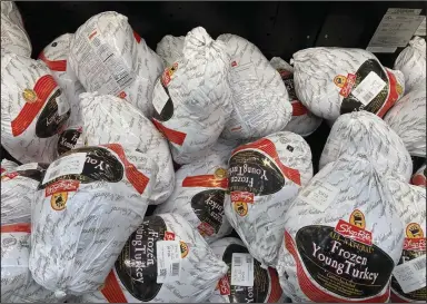  ?? (AP/Matt Rourke) ?? Frozen turkeys are displayed at a supermarke­t in Philadelph­ia, in November 2021.
