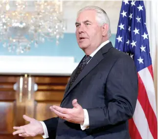  ??  ?? US Secretary of State Rex Tillerson talks to the media about the withdrawal from the Paris Climate Agreement at the State Department in Washington, on Friday. (Reuters)