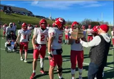  ?? TYNGSBORO HIGH PHOTO ?? Tyngsboro High players are awarded the Colonel’s Cup after defeating Groton-dunstable on Thursday at Lawrence Academy in Groton.