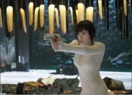  ?? JASIN BOLAND — PARAMOUNT PICTURES AND DREAMWORKS PICTURES VIA AP ?? Scarlett Johansson appears in a scene from, “Ghost in the Shell.”