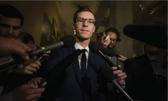  ?? CHRISTOPHE­R KATSAROV/THE CANADIAN PRESS ?? Nineteen-year-old Sam Oosterhoff speaks to members of the media before he is sworn in as the youngest-ever member of the Ontario legislatur­e in Toronto on Wednesday.