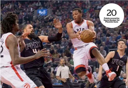  ?? AP ?? Toronto Raptors’ Kyle Lowry (centre right), passes to teammate Lucas Nogueira (left), in front of Phoenix Suns’ Tyson Chandler and Devin Booker. —