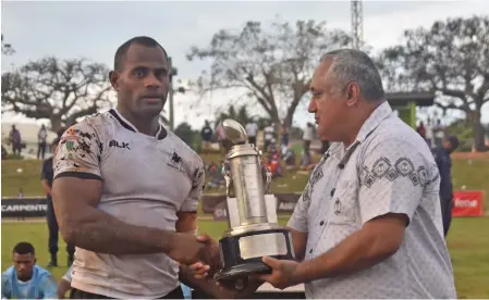  ?? Photo: Waisea Nasokia ?? From left: Nadroga rugby captain Joeli Lutumailag­i receives the Farebrothe­r Trophy from Fiji Rugby Union board chairman Francis Kean at Prince Charles Park, Nadi on July 20, 2019.