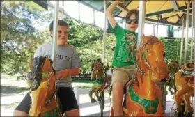  ?? PHOTO PROVIDED BY KAREN MYERS ?? Kenny Myers, now 12, and his sister, Jaclyn, now 11, rode carousel horses together in summer 2016 at a Buffalo zoo during a family vacation to Niagara Falls on the United States side.