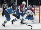  ?? JEFF ROBERSON — THE ASSOCIATED PRESS ?? The Blues’ David Perron (57) reaches for a loose puck as Avalanche goaltender Jonas Johansson and Cale Makar (8) defend during St. Louis’ 4-1 victory Monday.