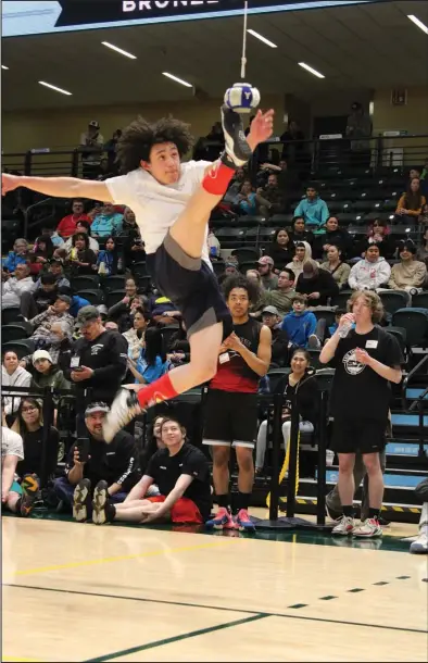  ?? Photo by Alohna Johnson ?? ONE FOOT HIGH KICK— First time NYO competitor Christophe­r Smith shows good form competing in last weekend’s NYO Games in Anchorage.