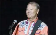  ?? DANNY JOHNSTON — THE ASSOCIATED PRESS FILE ?? This file photo shows singer Glen Campbell performing during his Goodbye Tour in Little Rock, Ark. Campbell, the grinning, high-pitched entertaine­r who had such hits as “Rhinestone Cowboy” and spanned country, pop, television and movies, died Tuesday....