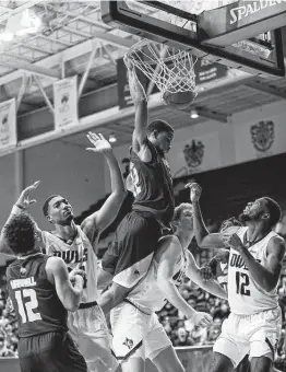  ?? Godofredo A. Vásquez / Staff photograph­er ?? Look out below as Texas State forward Nighael Ceaser dunks during the Bobcats’ second-half run to Tuesday night’s victory over Rice.