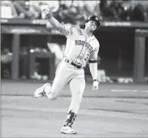  ?? Stephen Brashear Associated Press ?? THE ASTROS’ Jeremy Peña celebrates as he rounds the bases after hitting a home run to break a scoreless tie in the 18th.