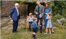  ?? Photograph: Kensington Palace/ AFP/Getty Images ?? The Duke and Duchess of Cambridge and Prince George (seated), Princess Charlotte and Prince Louis with Sir David Attenborou­gh (L) in the gardens of Kensington Palace.