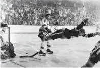  ?? RAY LUSSIER THE ASSOCIATED PRESS FILE PHOTO ?? Defenceman Bobby Orr goes airborne after scoring the game-winning goal that won the Stanley Cup for the Boston Bruins, one of the most beautifull­y captured but overrated moments in sports history.