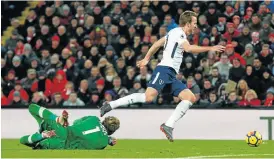  ?? /Reuters ?? Grounded: Liverpool goalkeeper Loris Karius brings down Tottenham’s Harry Kane, which led to a controvers­ial penalty at Anfield on Sunday.