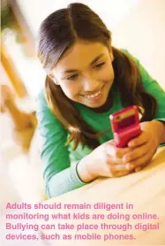  ??  ?? Adults should remain diligent in monitoring what kids are doing online. Bullying can take place through digital devices, such as mobile phones.