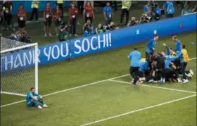  ?? ALEXANDER ZEMLIANICH­ENKO — THE ASSOCIATED PRESS ?? Russia goalkeeper Igor Akinfeev reacts as Croatia players celebrate after scoring the winning penalty during their quarterfin­al match on July 7.