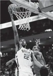  ?? Jonathan Daniel / Getty Images ?? Khris Middleton, left, and the Bucks are trying to stay alive after losing three straight to Toronto.