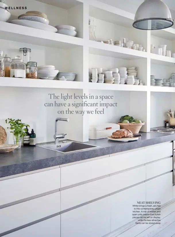  ??  ?? NEAT SHELVING
White brings a fresh, airy feel to this contempora­ry urban kitchen. A mix of hidden and open units means that stylish pieces can be left on display, while the less attractive items can be stored away