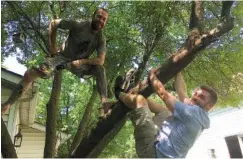  ?? DENISE CROSBY / CHICAGO TRIBUNE ?? Matt Ward, left, and brother Ryan, veteran members of Benny and the Elevators entertainm­ent team at the United Center, say they learned how to be daredevils in the backyard and playground­s of their childhoods in Aurora, Ill.