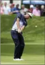  ?? STEW MILNE — THE ASSOCIATED PRESS ?? Bubba Watson hits his approach shot onto the second green during the final round of the Travelers Championsh­ip golf tournament Sunday in Cromwell, Conn.