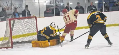  ?? JASON SIMMONDS/JOURNAL PIONEER ?? Sherwood-Parkdale Metros goaltender Sam Walsh stopped the Western Red Wings’ Jason Gallant on this first-period scoring chance in Game 3 of the best-of-seven Island Junior Hockey League final series as Alex Hall hustles back on defence. Walsh made 43...