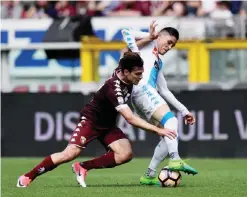  ??  ?? TURIN: Torino’s Argentinia­n forward Lucas Boye vies with Napoli’s Spanish striker Jose Maria Callejon (R) during the Italian Serie A football match Torino vs Napoli at the Olympic stadium. — AFP