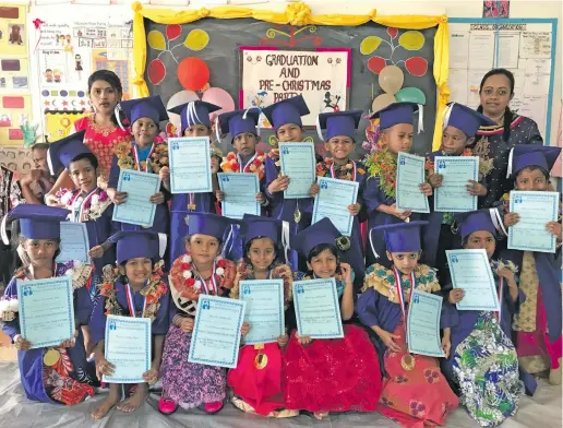  ?? Photo: Shratika Naidu ?? Wailevu Sanatan Dharam Kindergart­en teachers Radhika Ray (standing right) and Shobna Lata (standing left) with graduating students in Labasa on November 13, 2018.