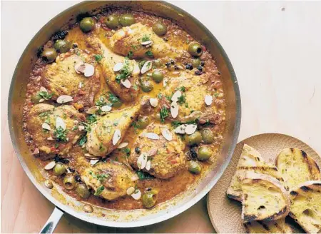  ?? DAVID MALOSH/THE NEWYORKTIM­ES ?? Acclaimed chef James Beard said he adapted this recipe for chicken with olives from Spanish immigrants who worked on ranches in California.