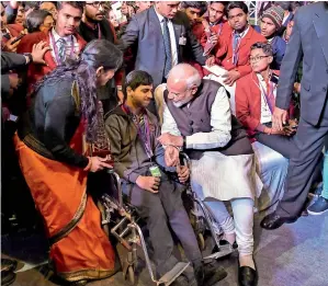  ?? PTI ?? Prime Minister Narendra Modi interacts with a wheelchair-bound student during ‘Pariksha Par charcha 2.0’ in New delhi on tuesday. —