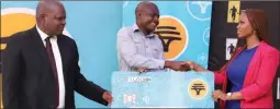  ?? PIC: KENNEDY RAMOKONE ?? There you are: Dube (centre) receives a cheque from Poroga (right) while BAA president Moses Bantsi looks on