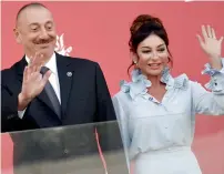  ?? AFP file ?? Azerbaijan’s President Ilham Aliyev and first lady and First Vice President Mehriban Aliyeva waving while standing on the podium after the Formula One Azerbaijan Grand Prix at the Baku City Circuit in Baku. —