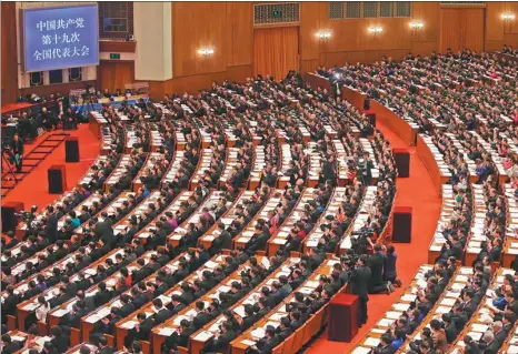  ?? JIN LIWANG / XINHUA ?? A general view shows delegates attending the opening of the 19th National Congress of the Communist Party of China in Beijing on Wednesday.