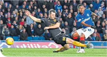  ??  ?? Alfredo Morelos fires home to make it 2-0 Rangers