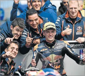  ?? Picture: AFP ?? TOP PERFORMANC­E: Red Bull KTM Ajo South African rider Brad Binder, centre, celebrates his victory with teammates after the Australian Moto3 race at Phillip Island yesterday