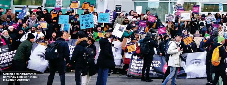  ?? ?? Making a stand: Nurses at University College Hospital in London yesterday